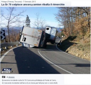 Immagine di un camion ribaltato.